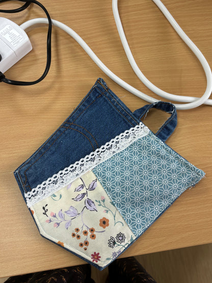 Handmade patchwork coaster featuring upcycled denim, floral fabric, blue geometric patterns, and white lace trim, created in a 2-hour sewing workshop