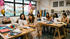 A bride-to-be and her besties laughing and crafting together during a private hen&